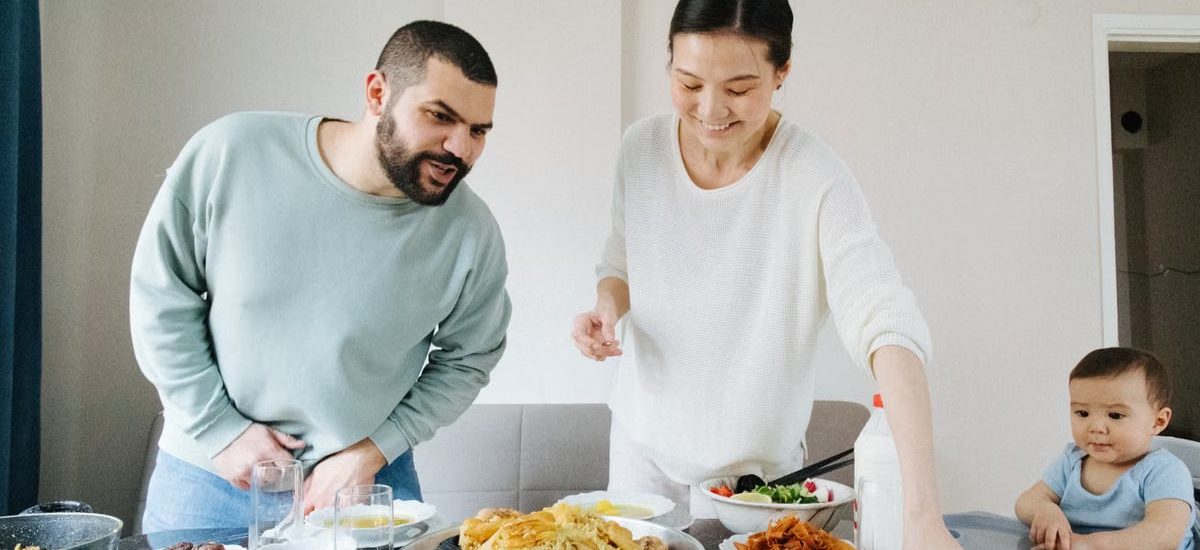 Family enjoying a meal together at home, celebrating with traditional dishes.