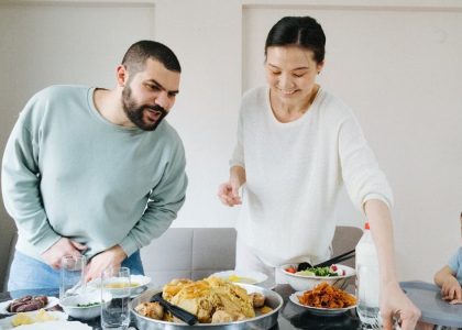 Family enjoying a meal together at home, celebrating with traditional dishes.
